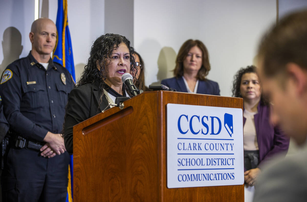 Clark County Education Association President Marie Neisess speaks beside Clark County School Di ...