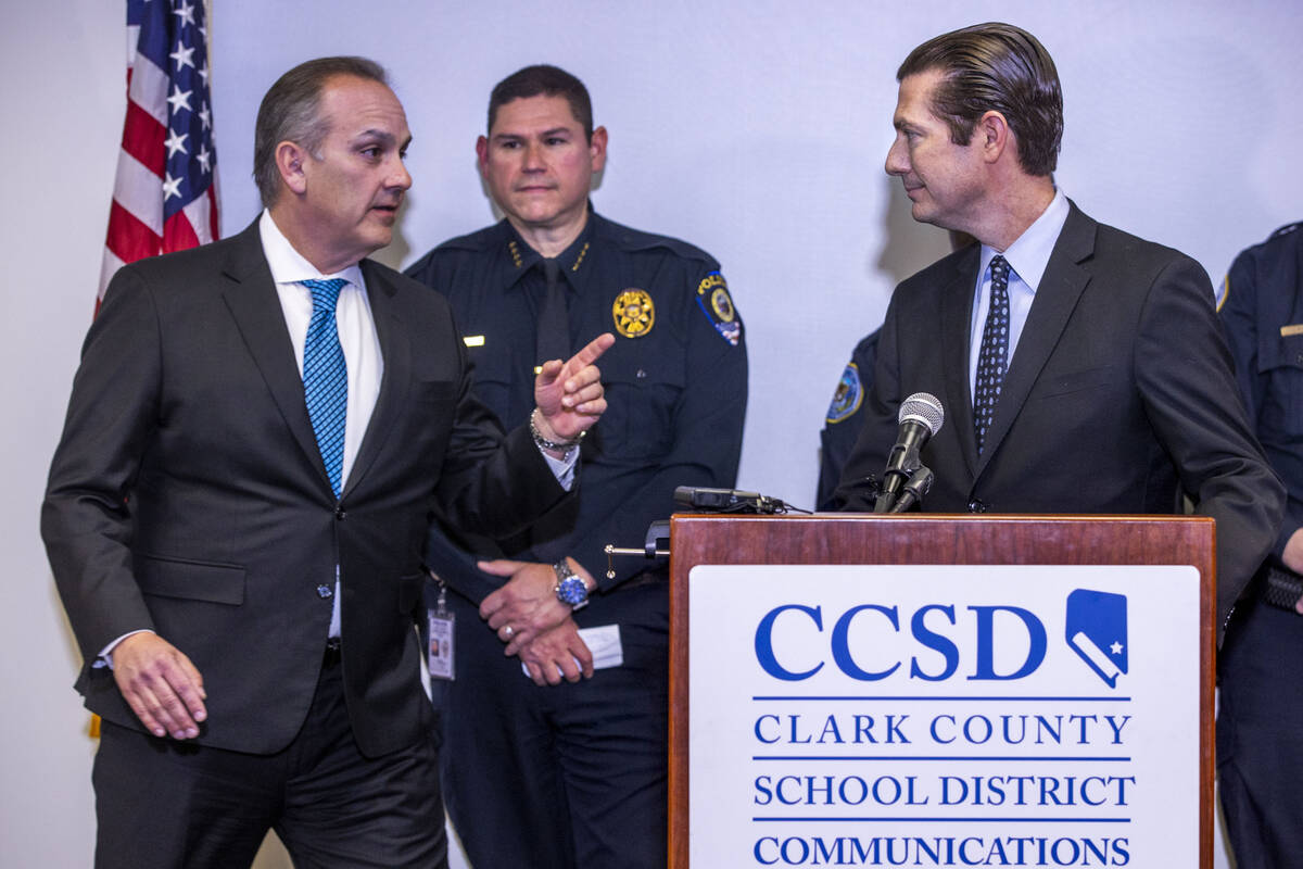 Clark County School District Superintendent Dr. Jesus F. Jara, left, steps in as Chief College, ...