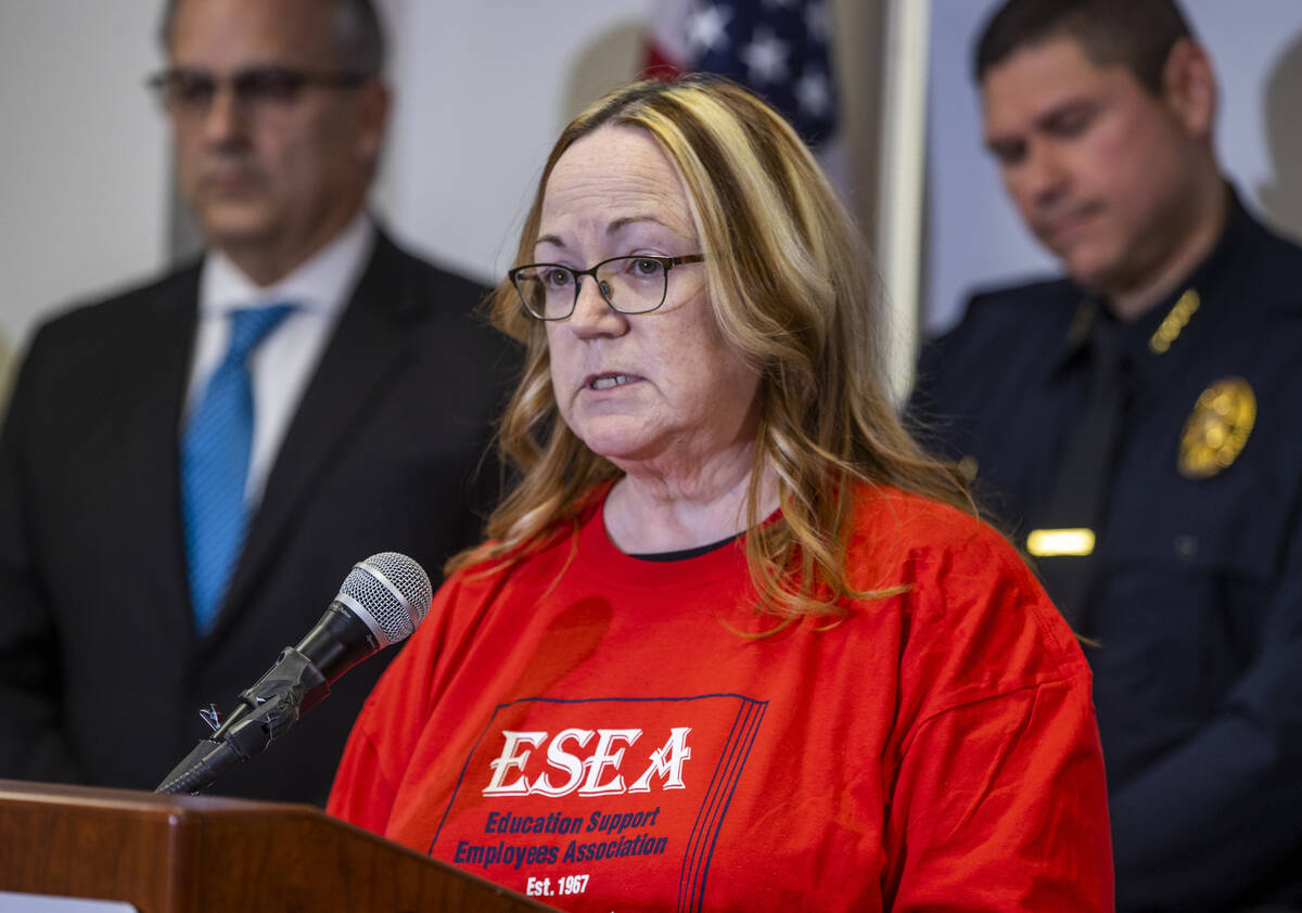 Education Support Employees Association President Jan Giles speaks beside Clark County School D ...