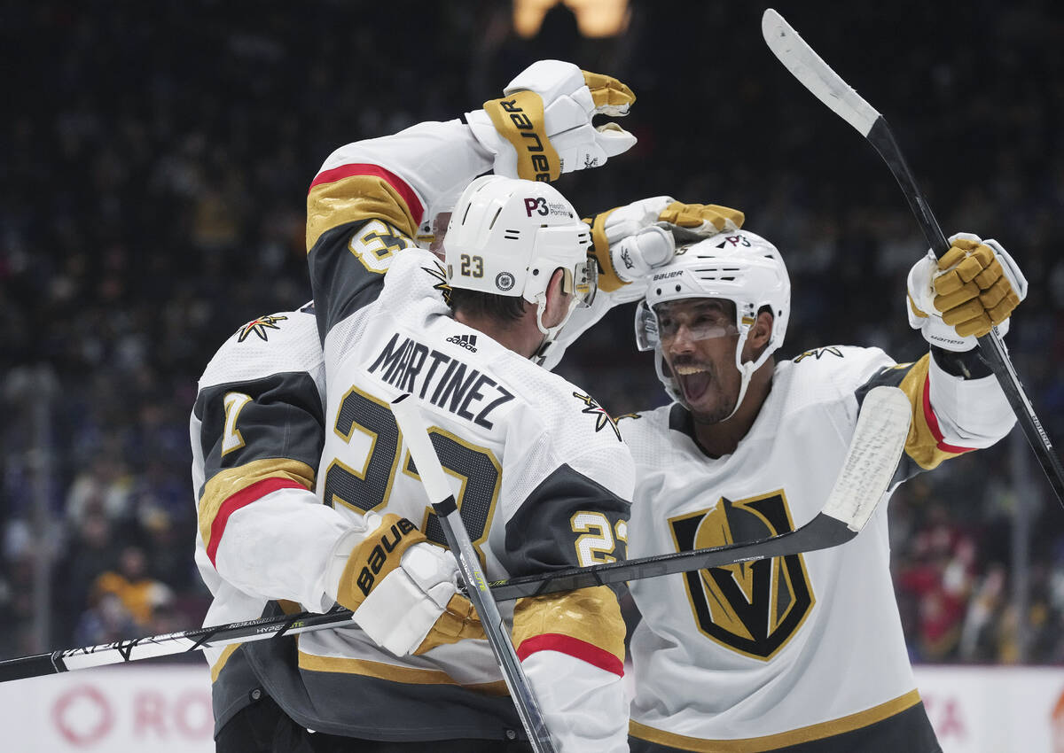 Vegas Golden Knights' Keegan Kolesar, right, Alex Pietrangelo, back left, and Alec Martinez cel ...