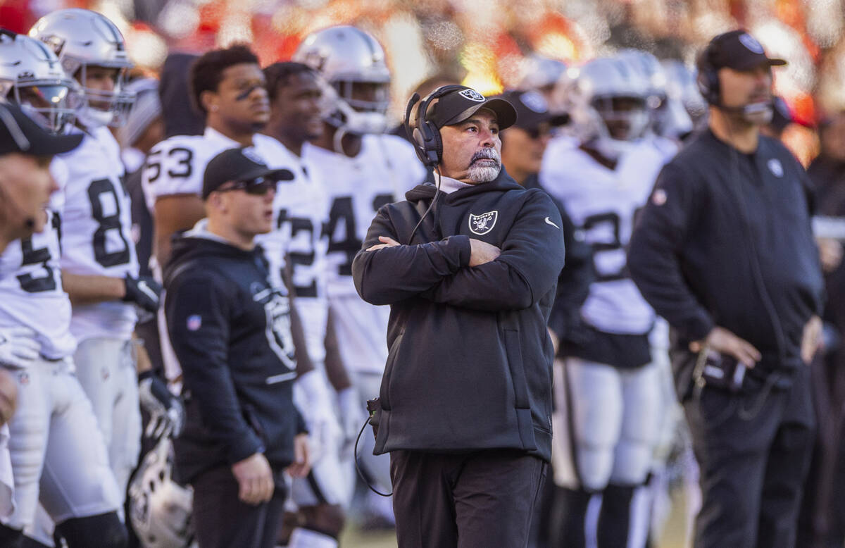 Raiders interim head coach Rich Bisaccia looks on as the Kansas City Chiefs score again late du ...
