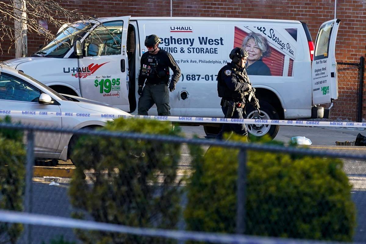 Bomb squad personnel search a moving truck during an ongoing investigation in the Brooklyn boro ...