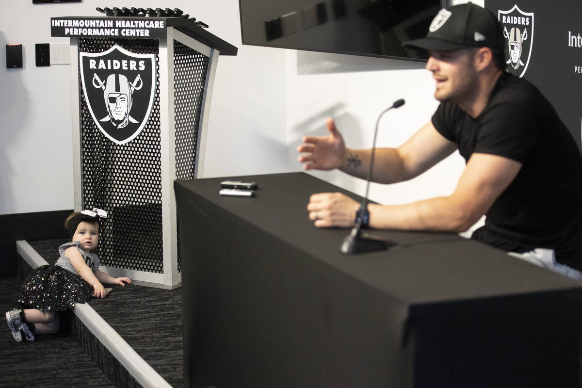 Raiders quarterback Derek Carr speaks on his three-year contract extension as his daughter Broo ...