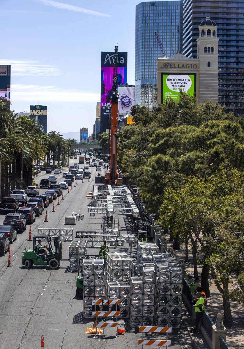 Construction workers assemble metal sections as work has started on the NFL red carpet draft st ...