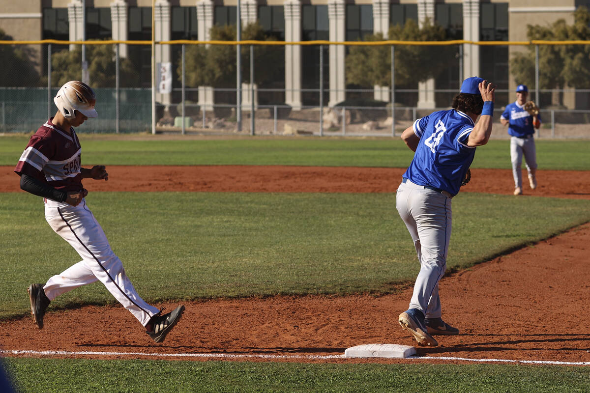 Bishop Gorman first baseman Easton Shelton (28) throws the ball after making a catch to put out ...