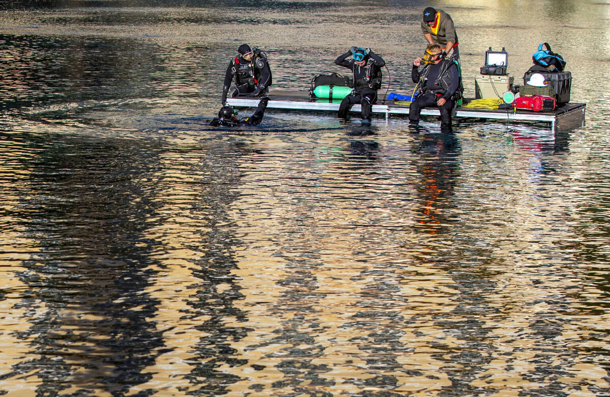 A dive crew readies to assist the first piece for the NFL Draft red carpet stage being lowered ...