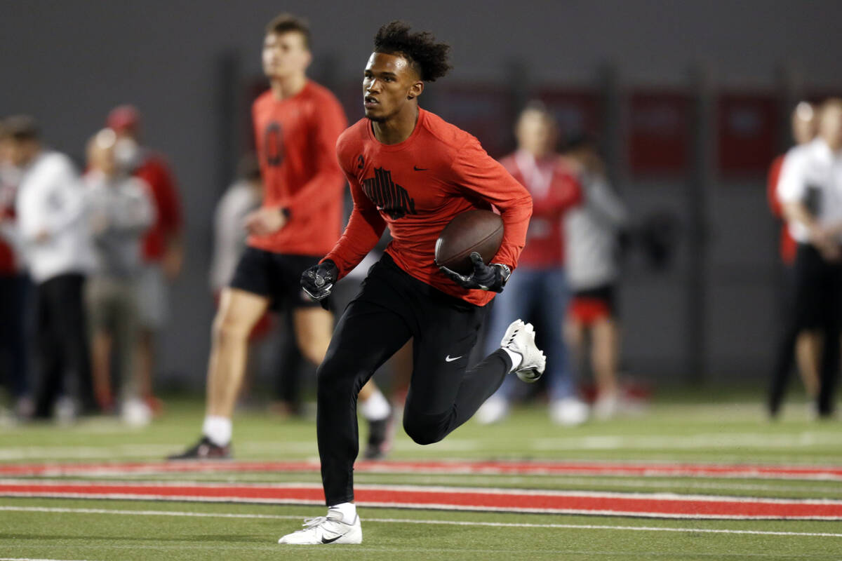 Wide receiver Garrett Wilson runs a football drill during Ohio State Pro Day in Columbus, Ohio, ...