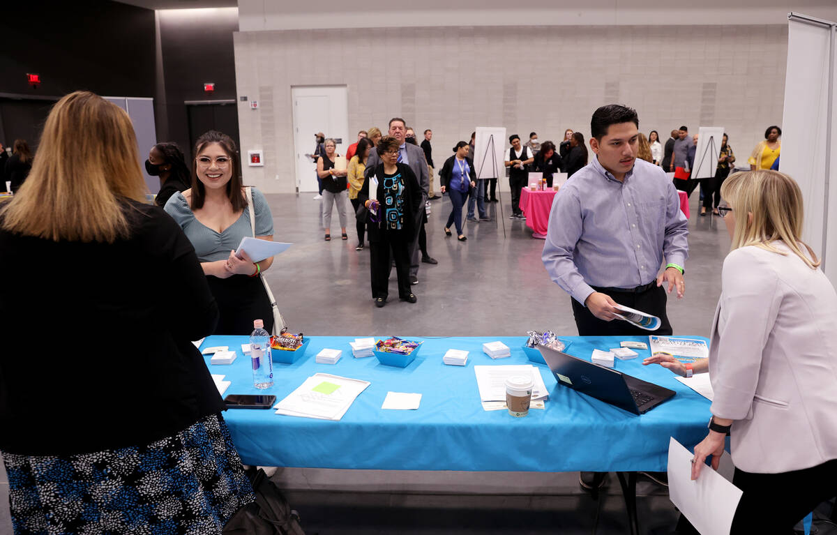 Jessica Castillo, 20, talks to Telauna Byamugisha, left, while her husband, Juan Castillo, 23, ...
