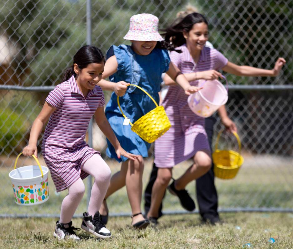 Children begin the Egg-Apalooza Easter egg hunt at the Paradise Recreational Center on Saturday ...