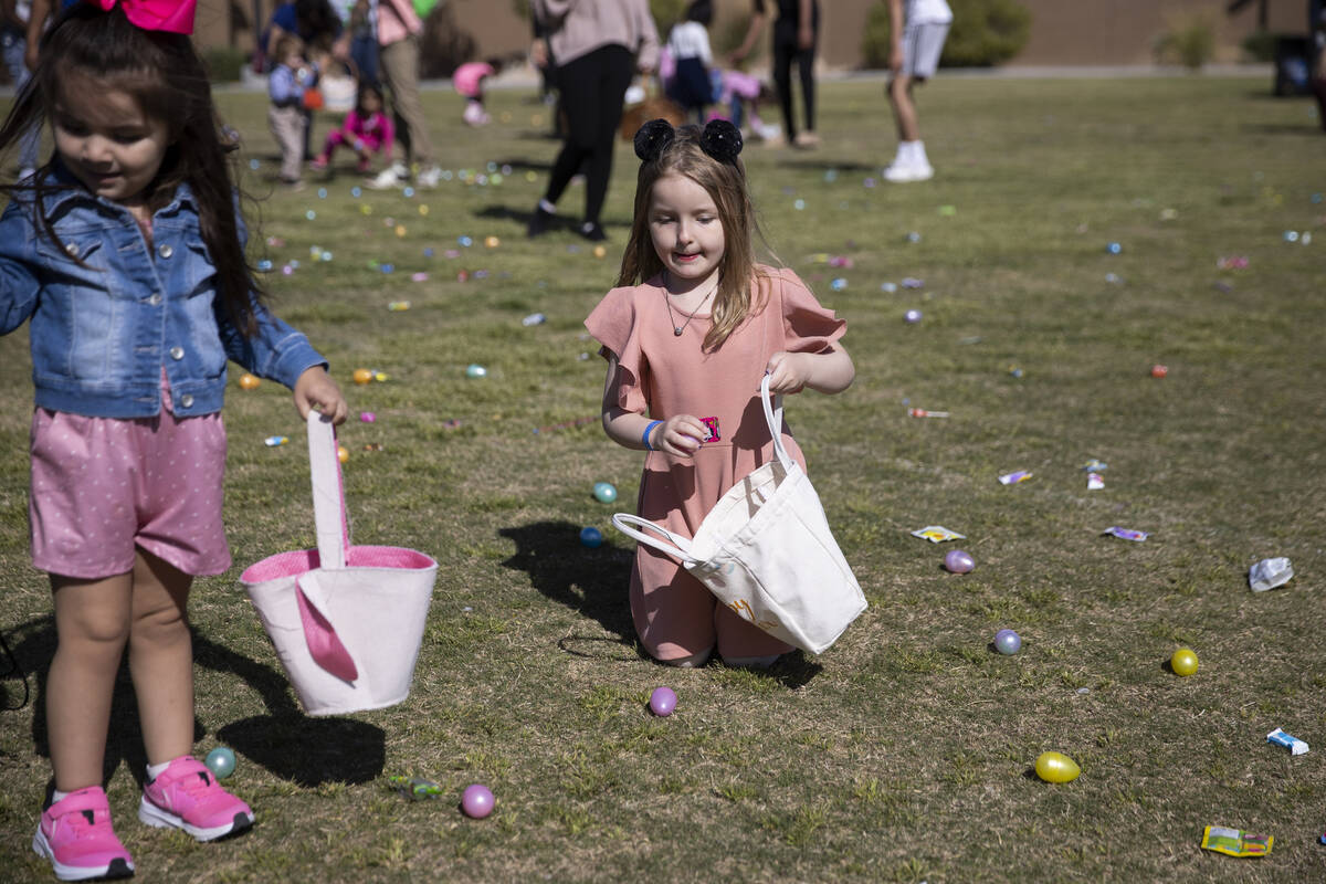 Iris Alexander, 5, center, participates during the Hoppy Egg Run community event at the Walnut ...