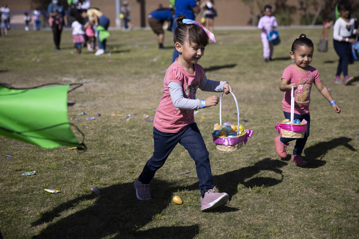 Vanessa Vega, 5, left, and her sister Valerie, 3, participate during the Hoppy Egg Run communit ...