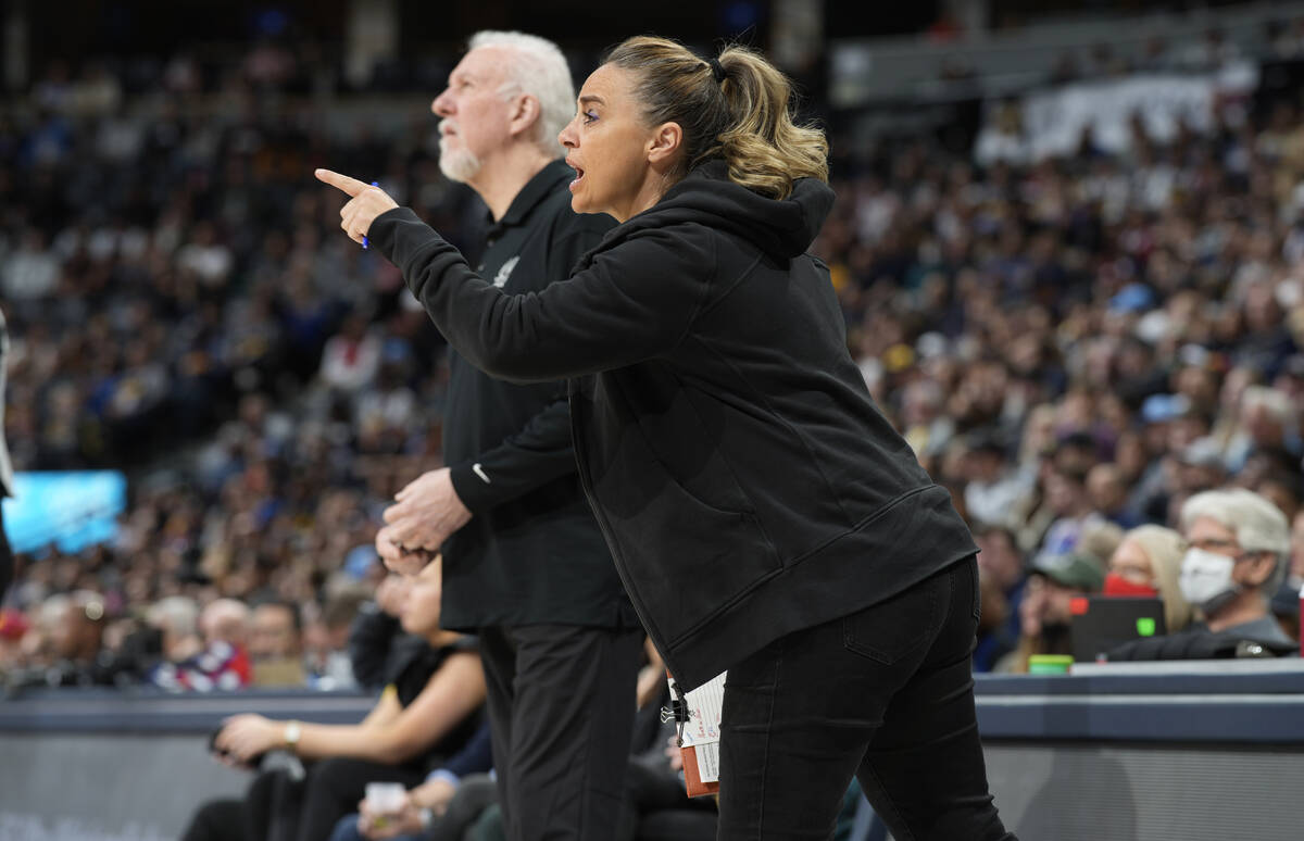 San Antonio Spurs assistant coach Becky Hammon, front, talks to players, next to coach Gregg Po ...