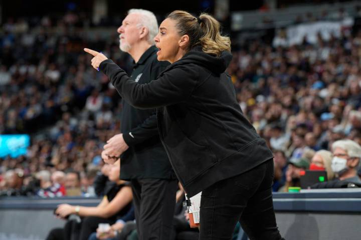 San Antonio Spurs assistant coach Becky Hammon, front, talks to players, next to coach Gregg Po ...