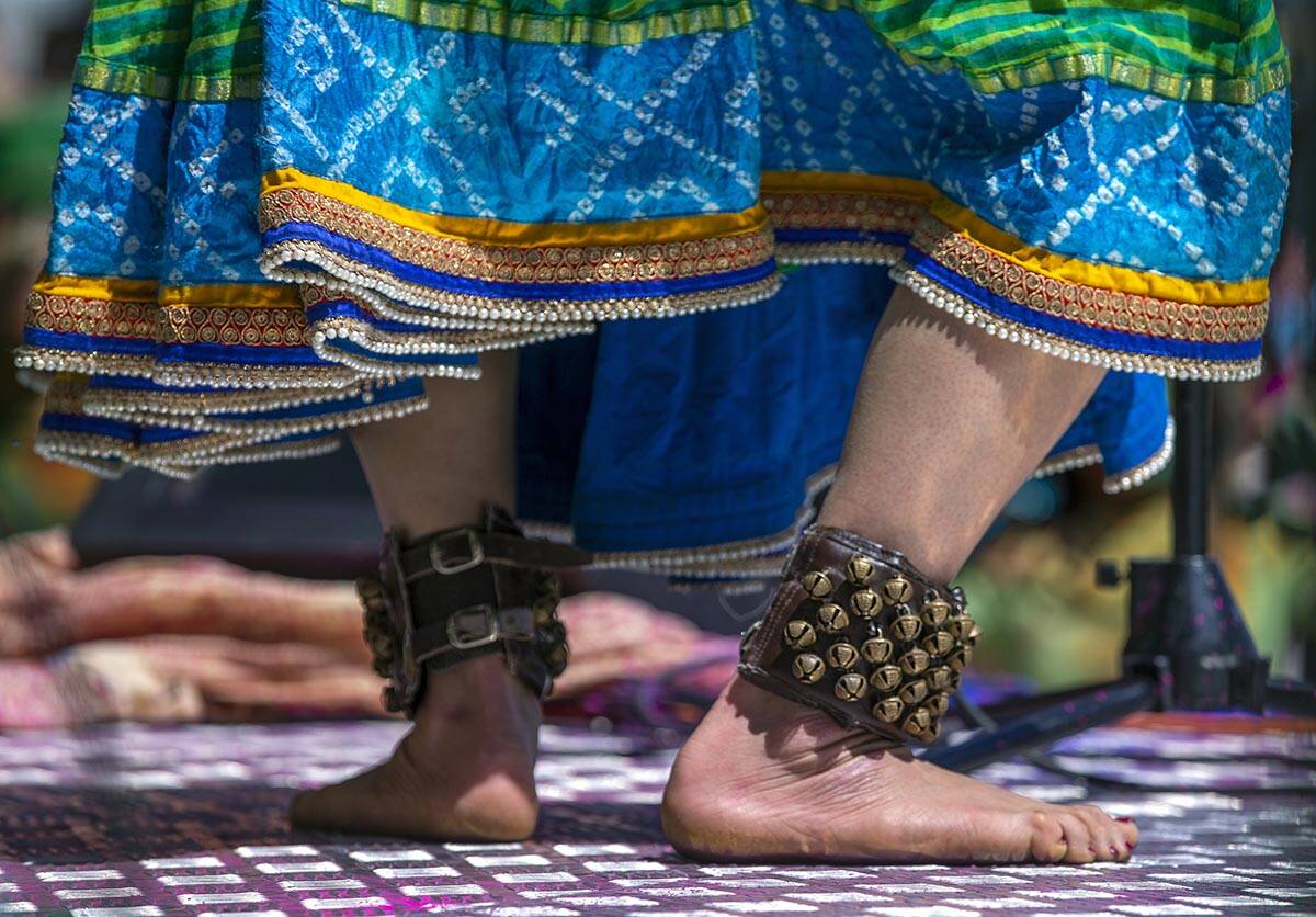 A dancer instructs the crowd during the Holi Festival of Colors which features music, dance, fo ...