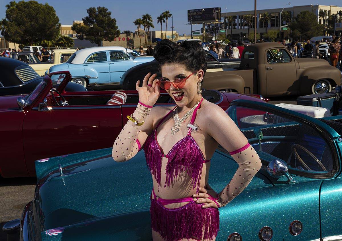 Las Vegas native Abby Dandy poses for photos in front of classic cars during the Rockabilly Car ...