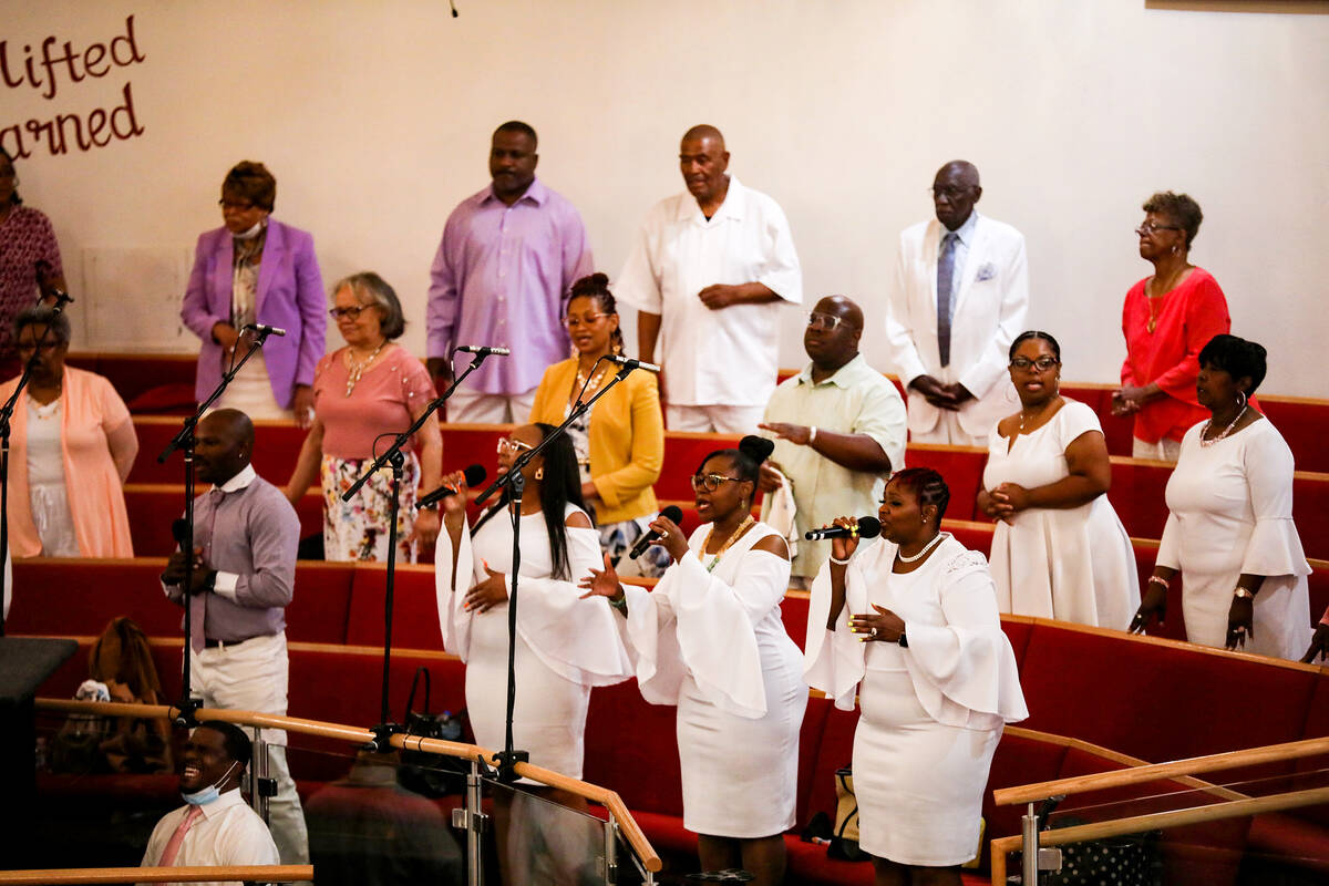The choir leads the congregation in song during Easter service at Victory Missionary Baptist Ch ...