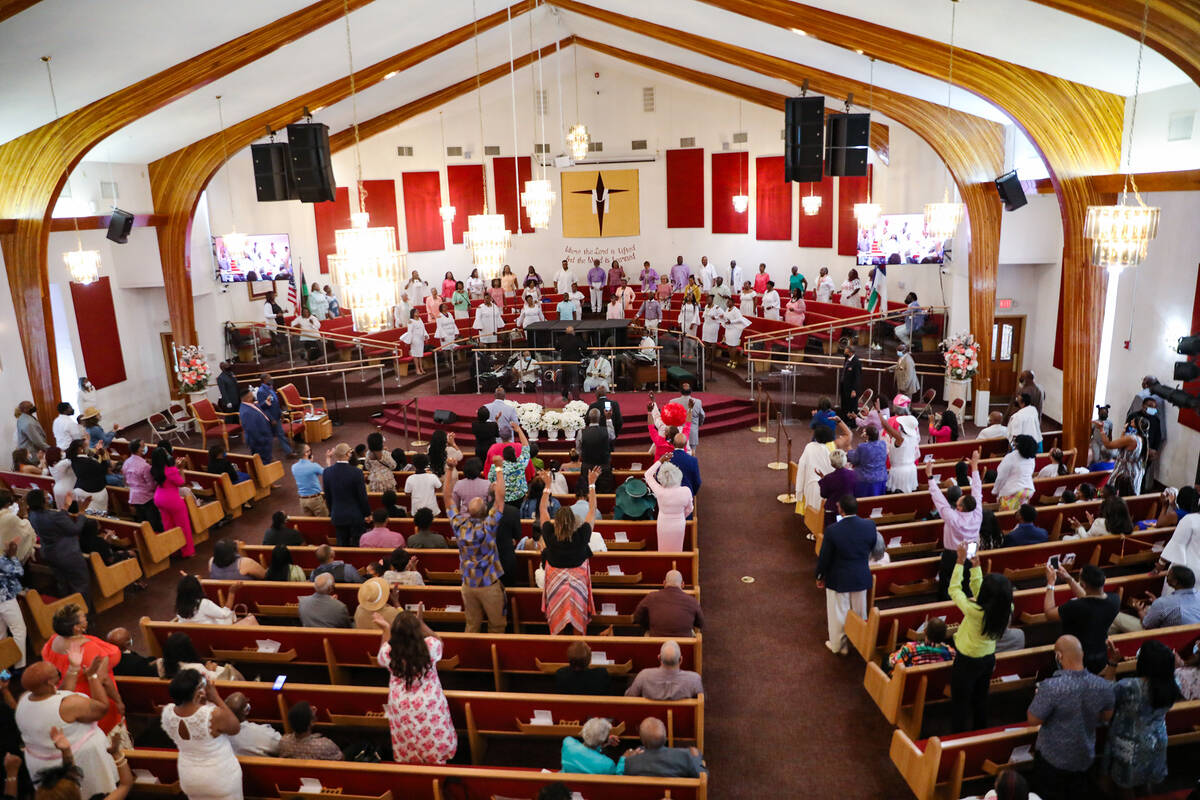 The choir leads the congregation in song during Easter service at Victory Missionary Baptist Ch ...