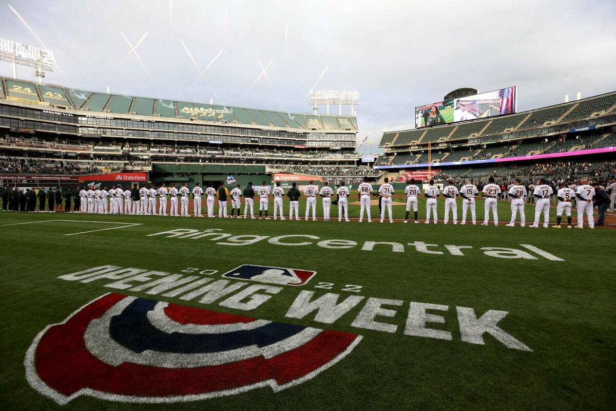 The Oakland Athletics line up on the baseline before a baseball game against the Baltimore Orio ...