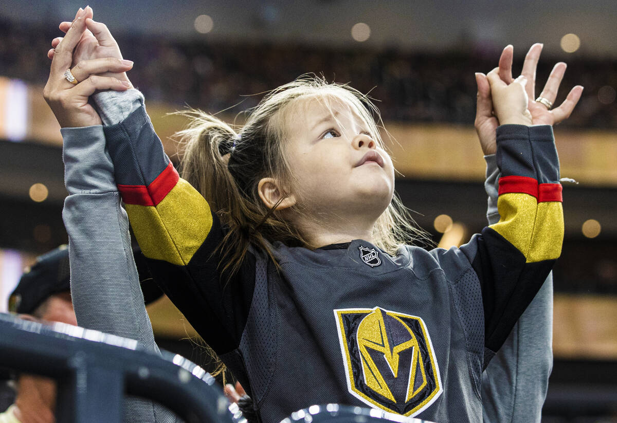 Golden Knights fans cheer for Vegas during an NHL hockey game against the New Jersey Devils on ...