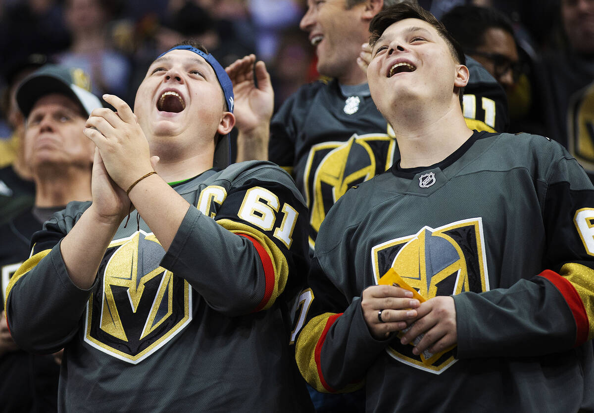 Golden Knights fans cheer for Vegas during an NHL hockey game against the New Jersey Devils on ...