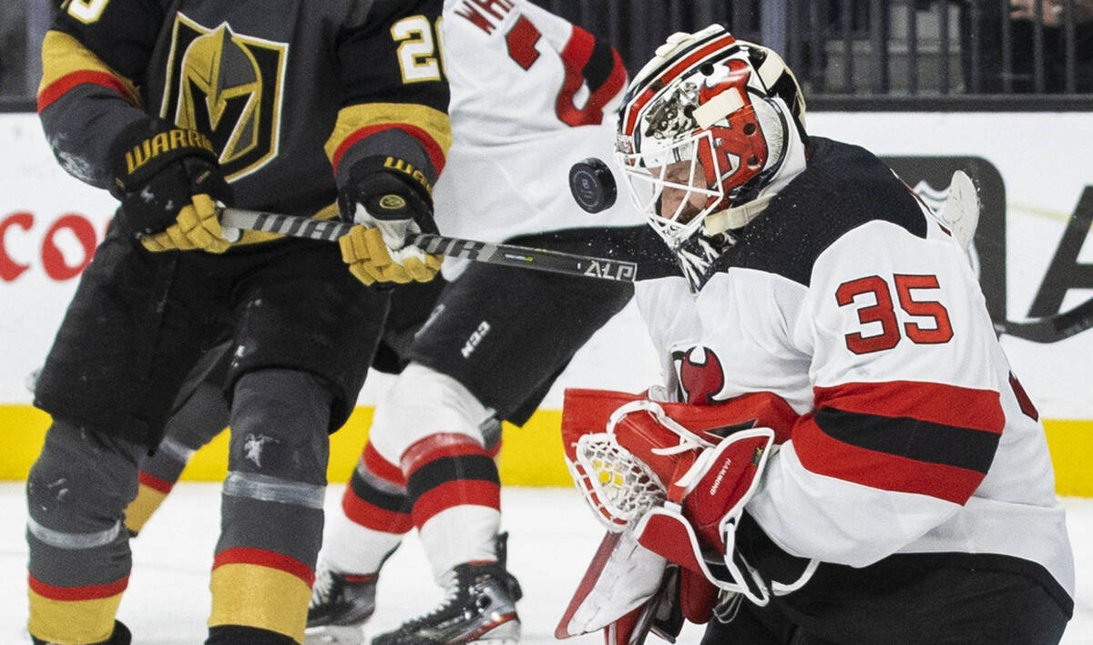 New Jersey Devils goaltender Andrew Hammond (35) makes a save against Golden Knights center Cha ...