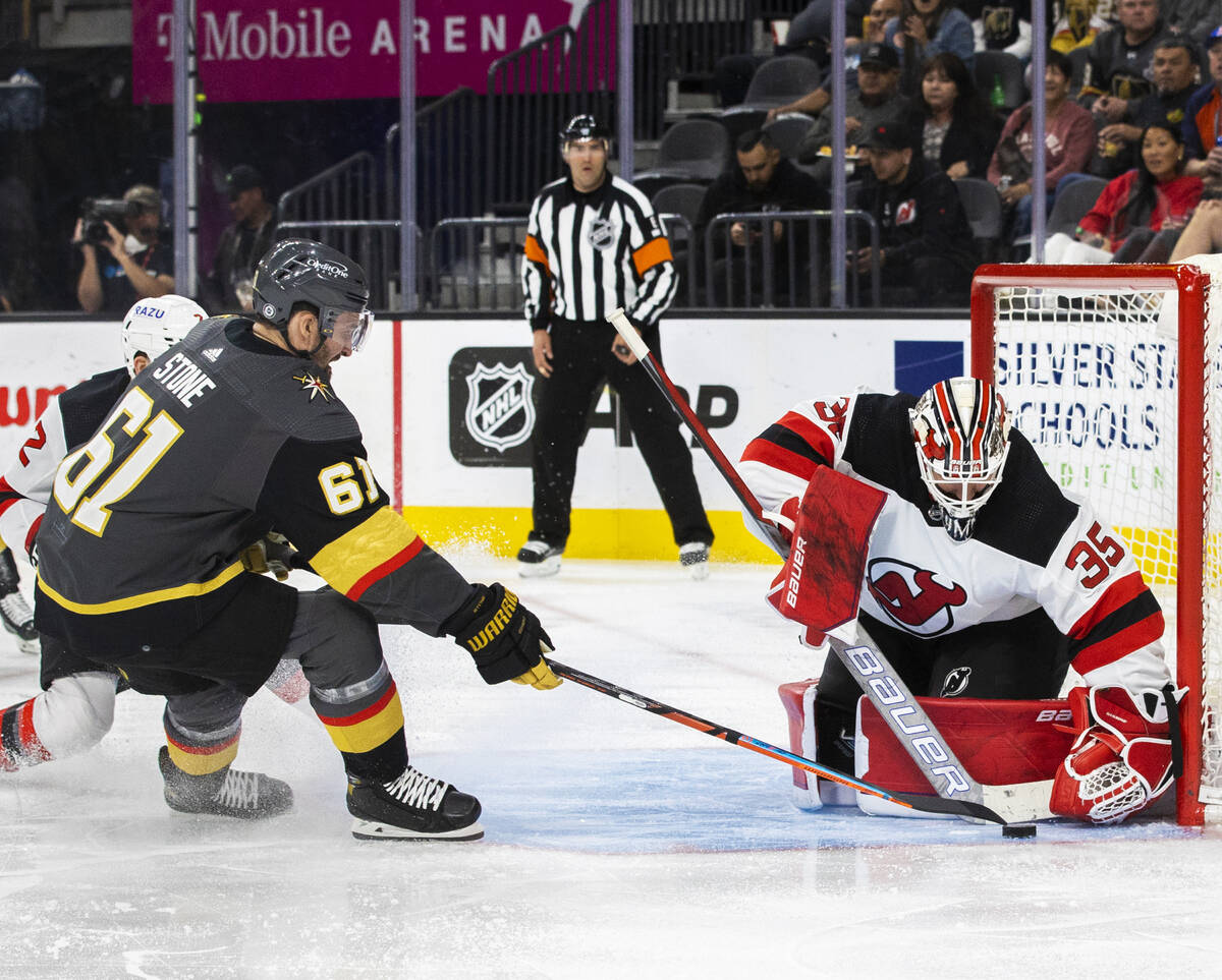 Golden Knights right wing Mark Stone (61) shoots on New Jersey Devils goaltender Andrew Hammond ...