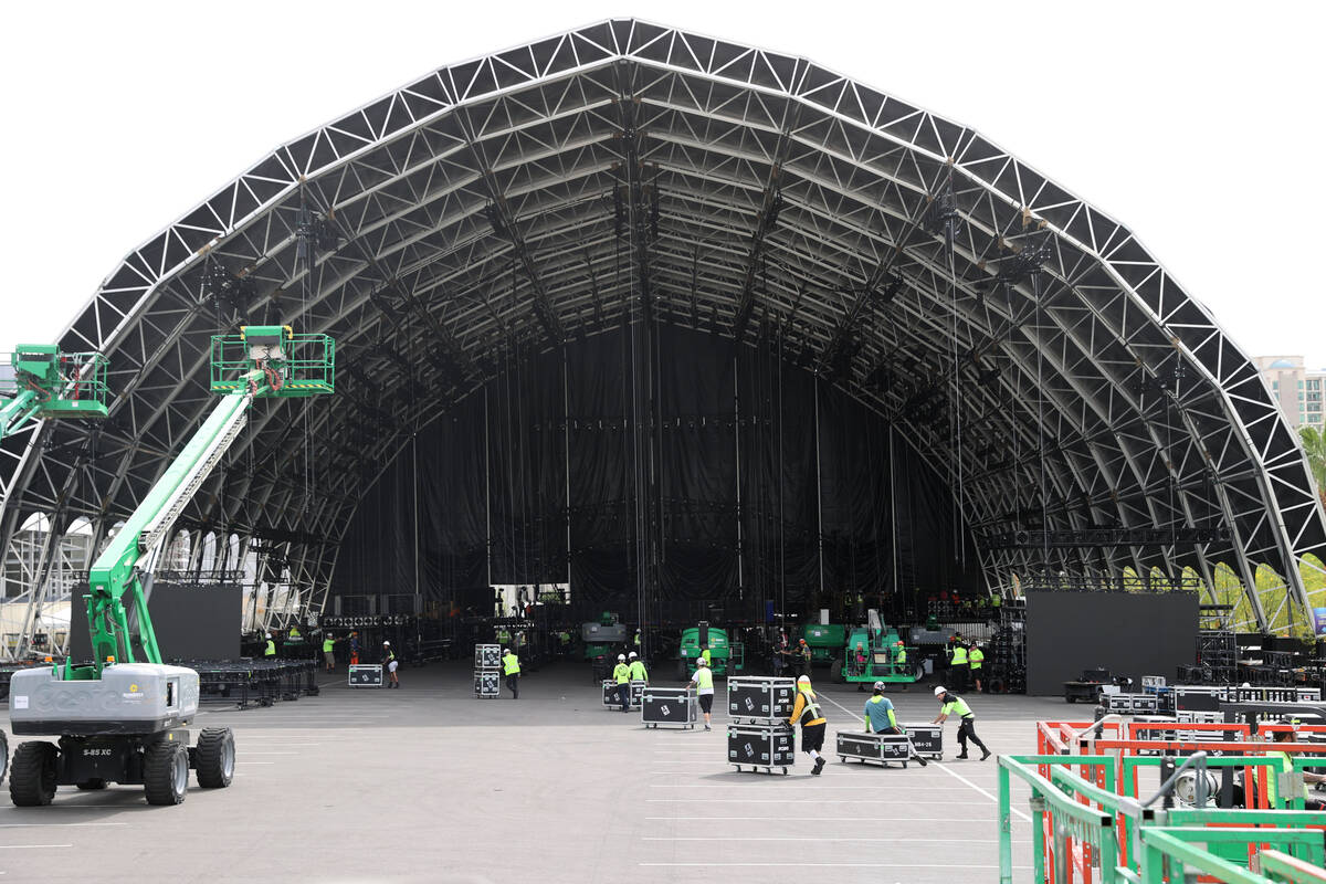 The main stage at the NFL Draft Experience under construction behind The Linq Hotel in Las Vega ...