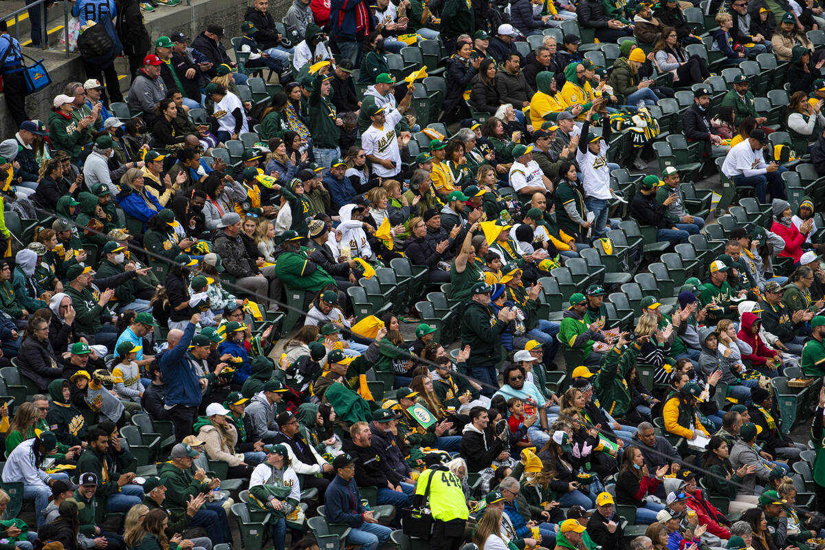 Oakland Athletics fans watch the opening night game against the Baltimore Orioles on Monday, Ap ...