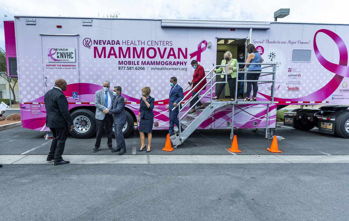 Guests gather after touring the Nevada Health Center's Mammovan as HHS Secretary Xavier Becerra ...