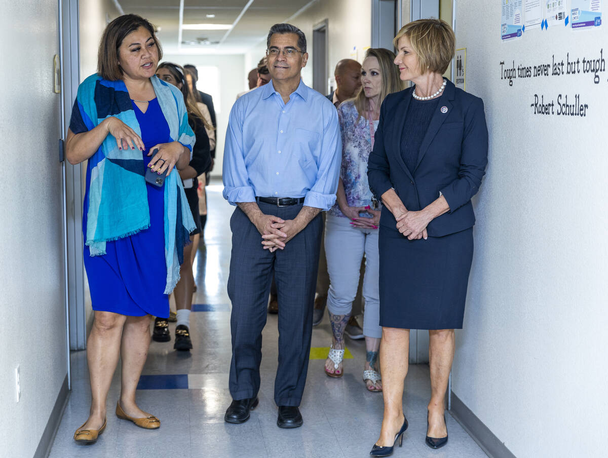 From left, Fuiala Riley, President and CEO HELP of Southern Nevada, gives a tour to HHS Secreta ...