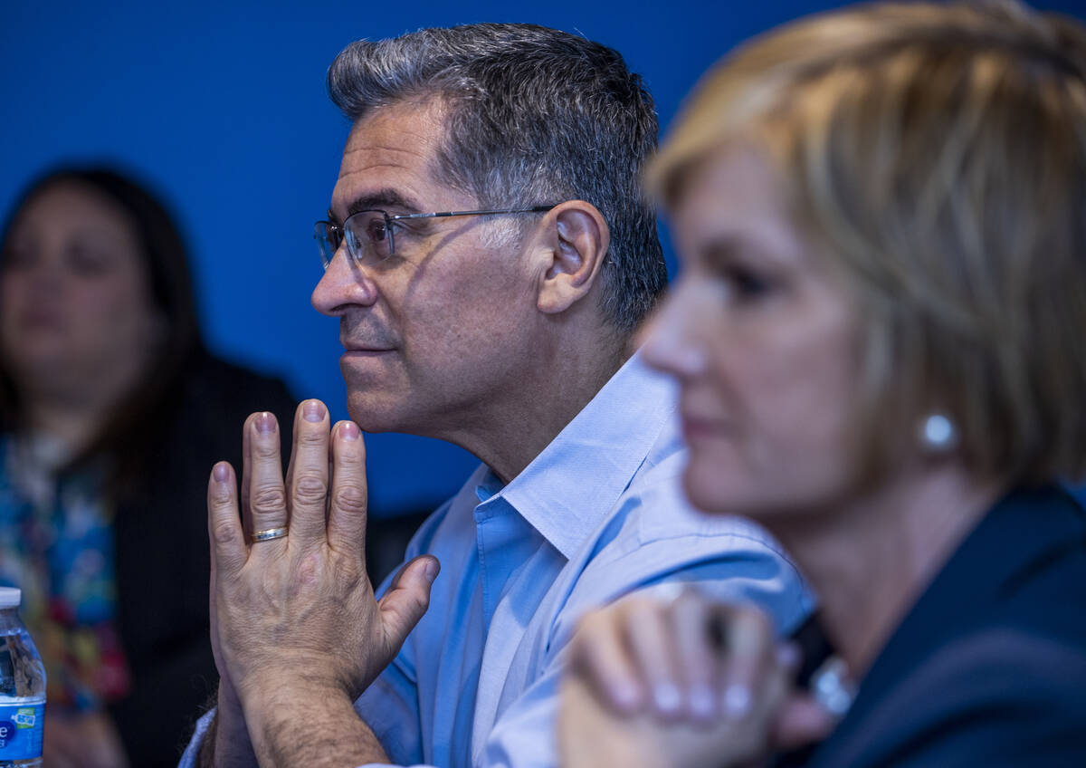 U.S. Department of Health and Human Services Secretary Xavier Becerra and Rep. Susie Lee listen ...