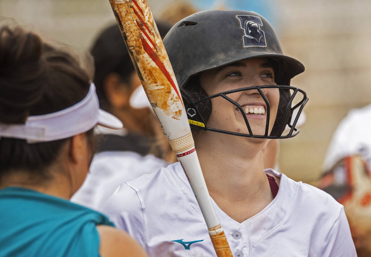 Silverado’s Olivia Johnson (15) shares a laugh with teammates during a girls high school ...
