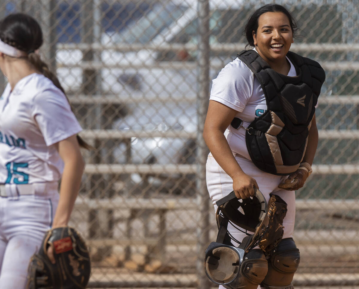 Silverado’s Maria Jimenez (11) shares a laugh with teammate Olivia Johnson (15) during a ...