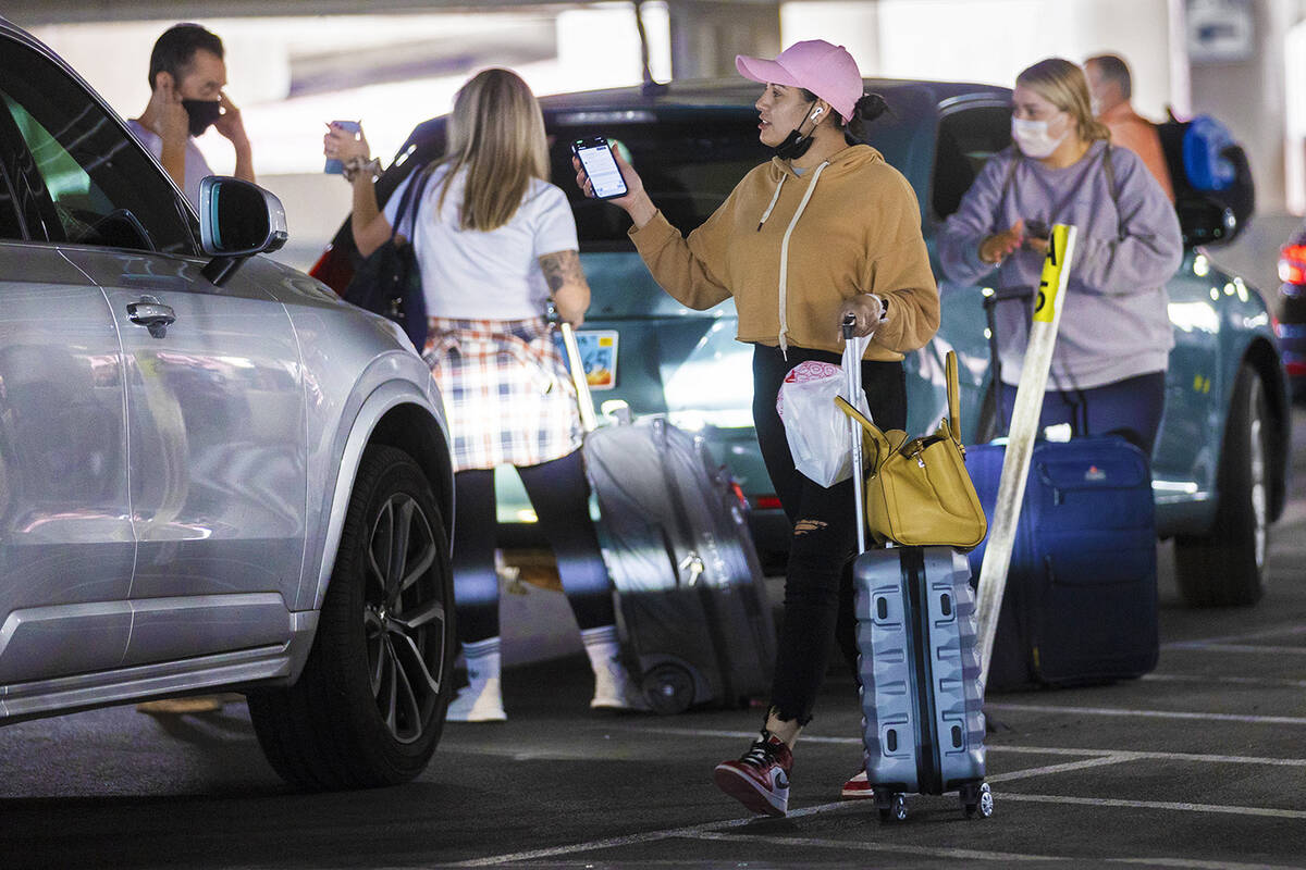 Passengers pick up their ride shares at Harry Reid International Airport on Tuesday, April 5, 2 ...