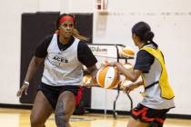 Las Vegas Aces center Kalani Brown,l eft, defends during team’s practice at the Cox Pavi ...