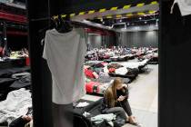 Refugees from Ukraine stay inside a vast accommodation center set up at the Global EXPO exhibit ...