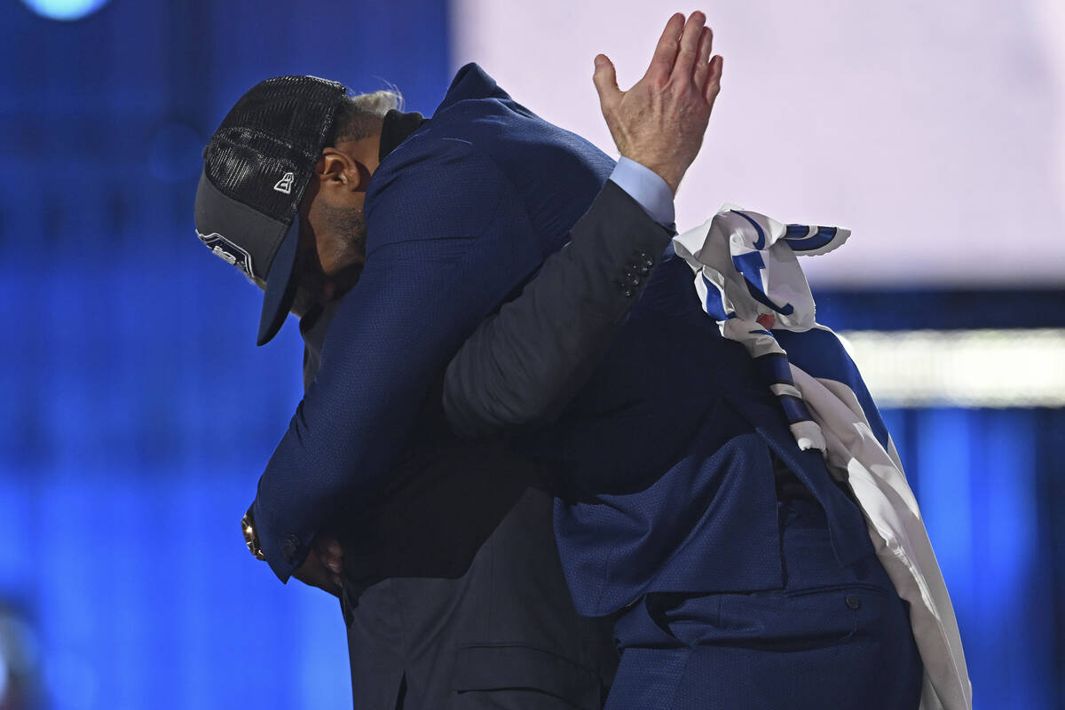 Penn State linebacker Micah Parsons, right, hugs NFL Commissioner Roger Goodell after the Dalla ...