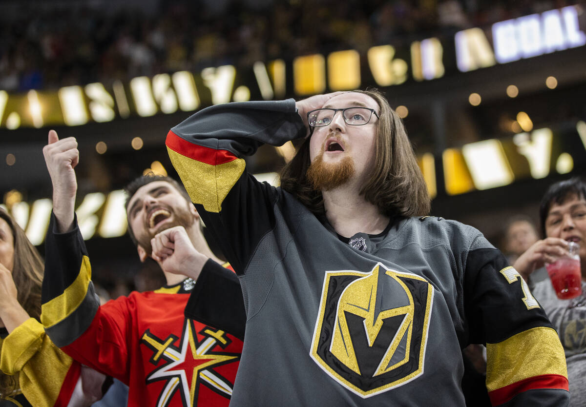 Golden Knights fans cheer for Vegas during an NHL hockey game against the Washington Capitals o ...