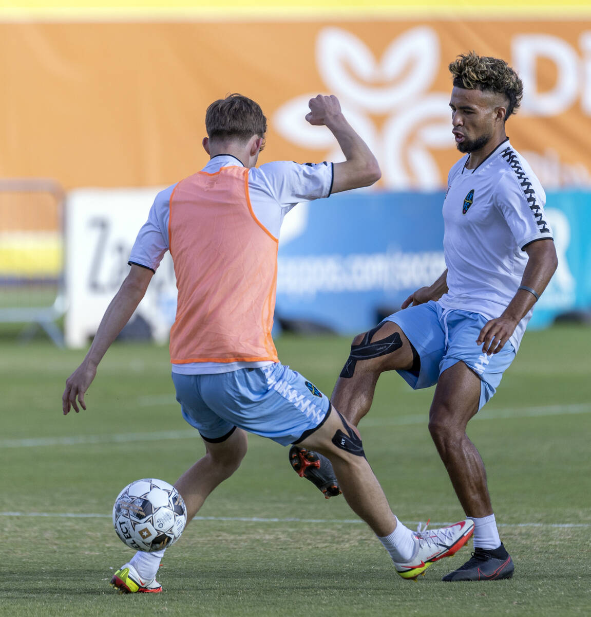 Lights FC standout Danny Trejo, right, kicks a ball past a teammate during practice at Cashman ...