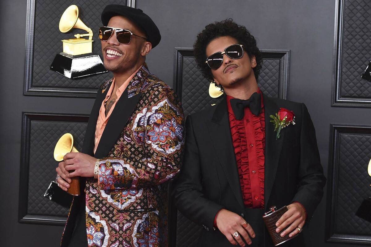 FILE - Anderson .Paak, left, and Bruno Mars, of the duo Silk Sonic, appear at the 63rd annual G ...