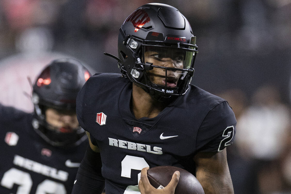 UNLV Rebels quarterback Doug Brumfield (2) goes for a touchdown during the fourth quarter of an ...