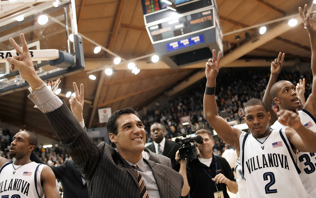 FILE -V illanova coach Jay Wright and players, from left, Will Sheridan, Randy Foye (2) and Dan ...