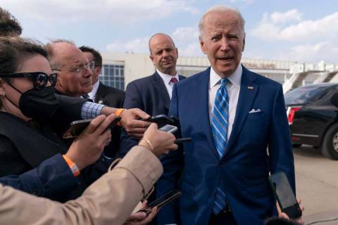 President Joe Biden speaks to the media before boarding Air Force One at Des Moines Internation ...