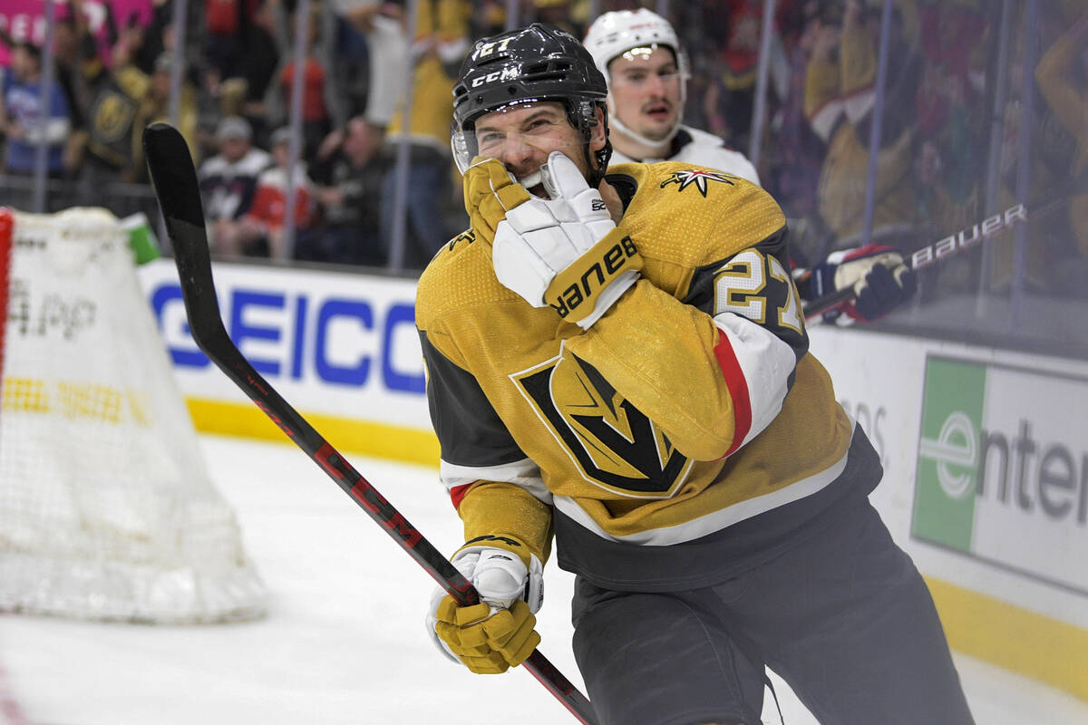 Vegas Golden Knights defenseman Shea Theodore (27) speaks with the