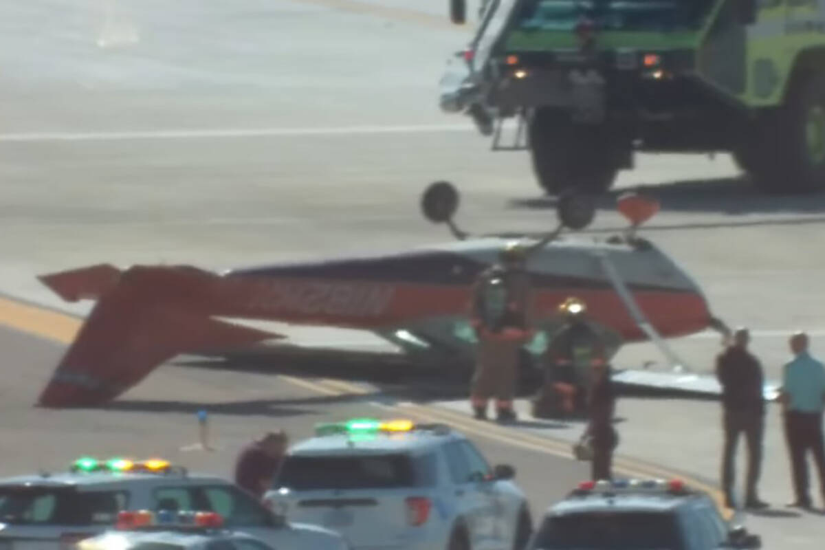 A small plane flipped over at Harry Reid International Airport on Thursday morning with two peo ...