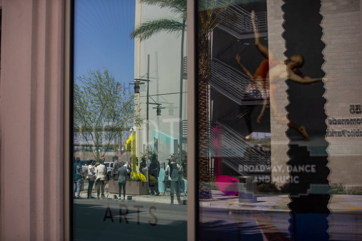 The "Larger Than Life" public art piece is reflected in a window at Symphony Park on ...