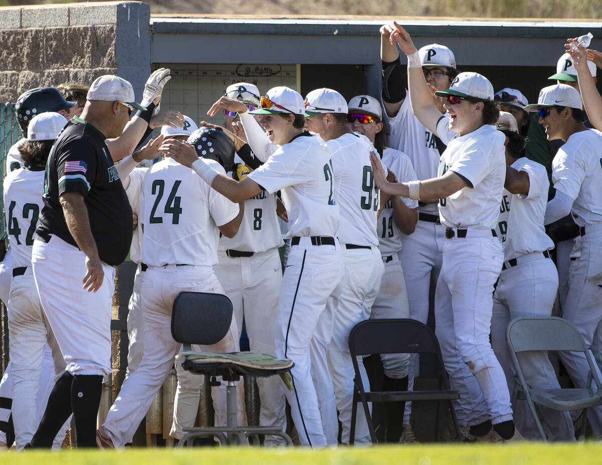 Palo High’s outfielder Kyle Williamson (24) congratulated by his teammates after hittin ...