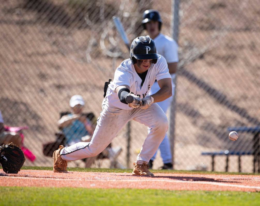 Palo High’s second baseman Jackson Tanko (14) bunts against Coronado High during the sec ...