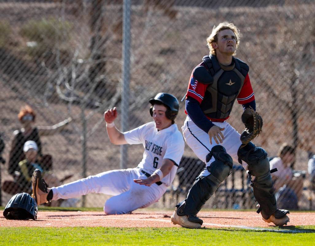 Palo High’s Andrew Kaplan (6) scores at home as Coronado High’s catcher Dallin Sm ...