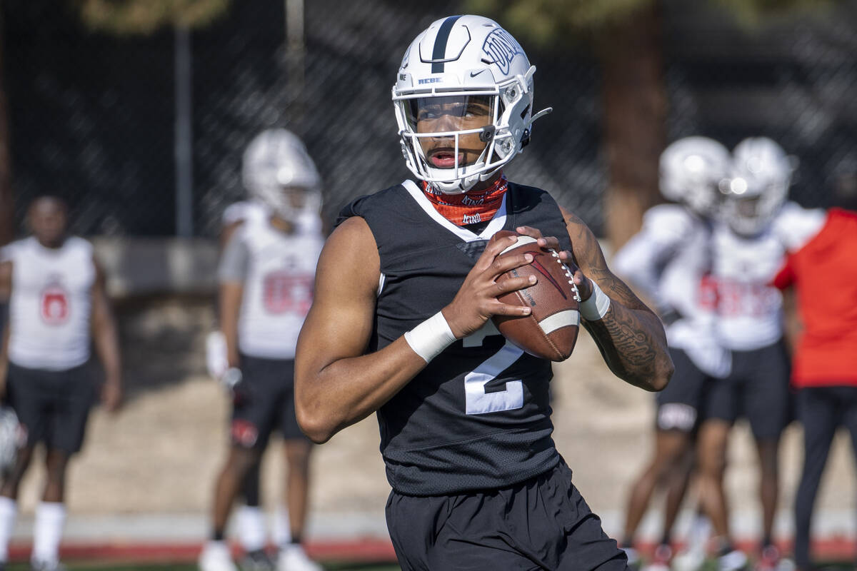 UNLV quarterback Doug Brumfield (2) drops back for a pass during the first spring football prac ...